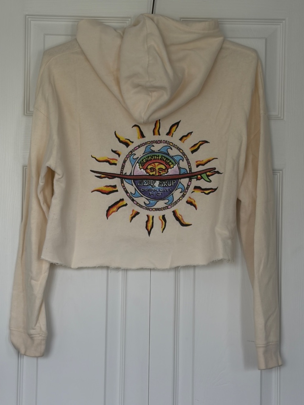Cropped Cream Hoodie with Vibrant Sun Graphic
